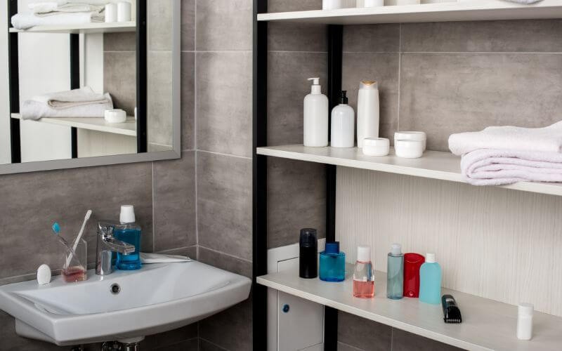 Bathroom shelves organised per person in a Dublin house share