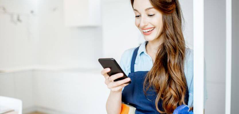 eMop cleaner in Dublin checking booking confirmation on their phone