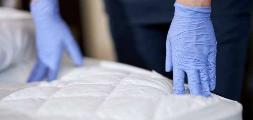 eMop cleaner treating spots on a mattress